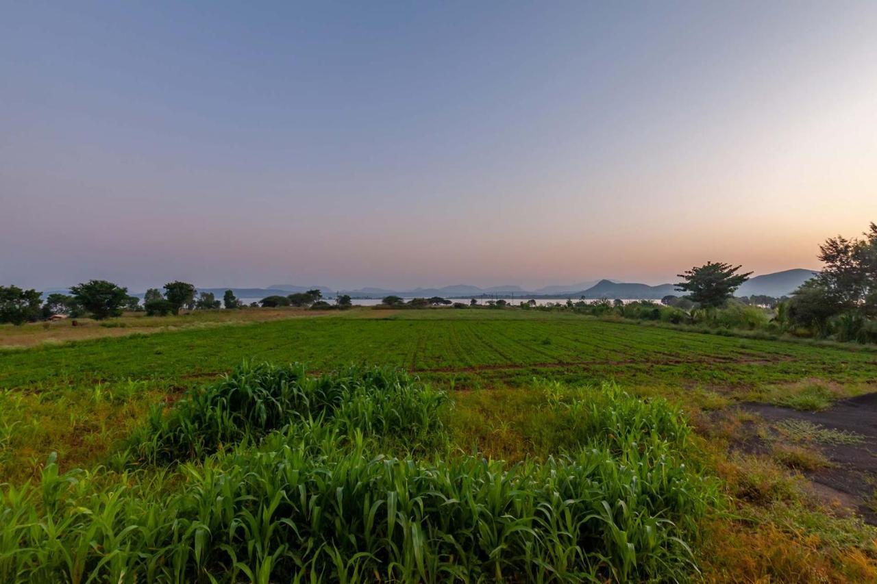 Stayvista's Lake La Vie: Tranquil Lakeside Villa with Pool and Farmland Views Nashik Exterior photo